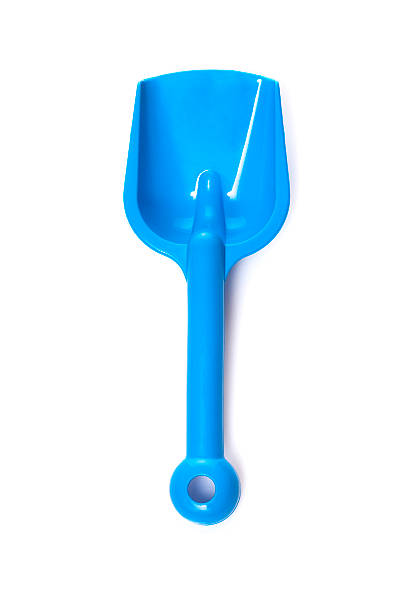 Toy small spade Toy small spade isolated on white background sand pail and shovel stock pictures, royalty-free photos & images
