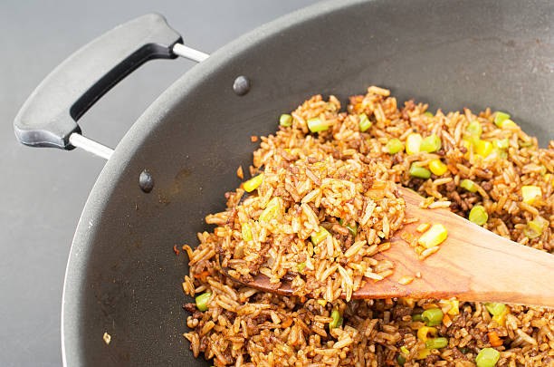 Chinese fried rice in a wok closeup studio shot