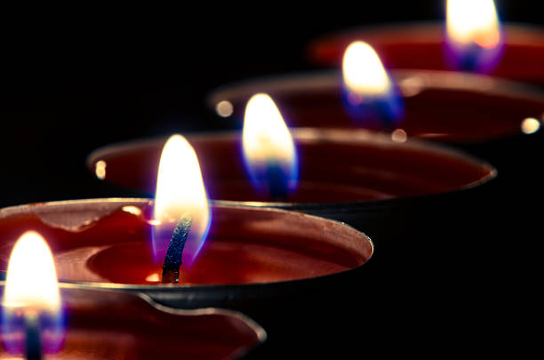istock red burning candles detail 475725680
