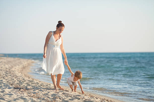 istock Mother and Son on the Beach 475726088