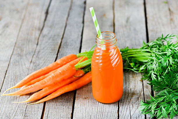 istock Carrots and carrots juice 475726170