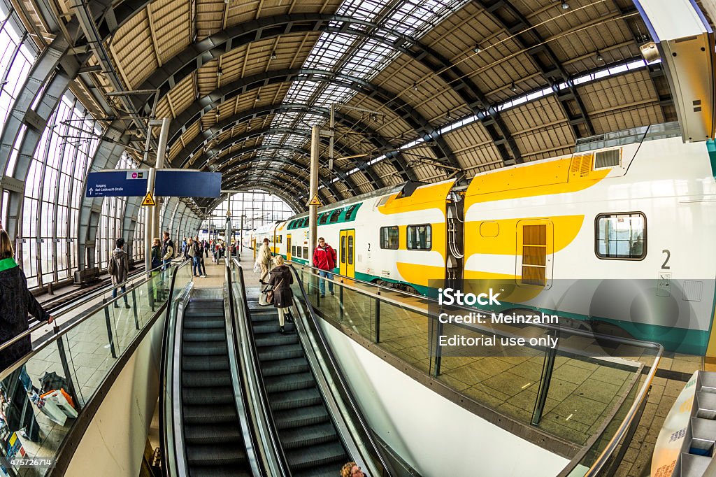 people travel at Alexanderplatz subway station in Berlin Berlin, Germany - October 27, 2014: peope travel at Alexanderplatz subway station in Berlin, Germany. The station was built in 1882 by Johann Eduard Jacobsthal. 2015 Stock Photo