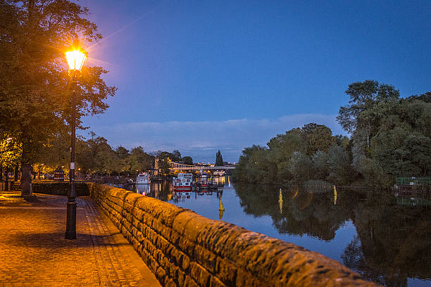istock Night scene of city by a river 475727510