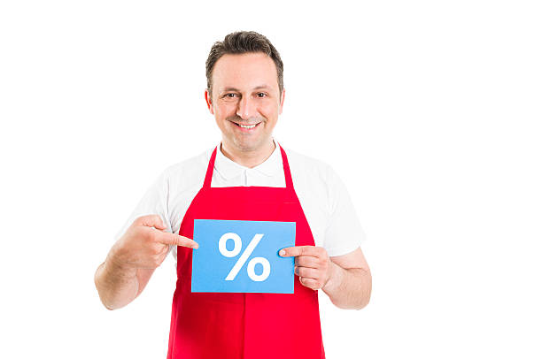 istock Friendly supermarket employee holding discount sign 475729172