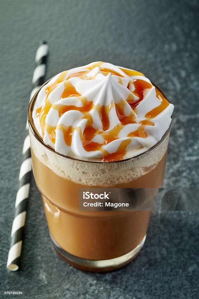 glass of caramel latte coffee glass of caramel latte coffee  with whipped cream 2015 Stock Photo