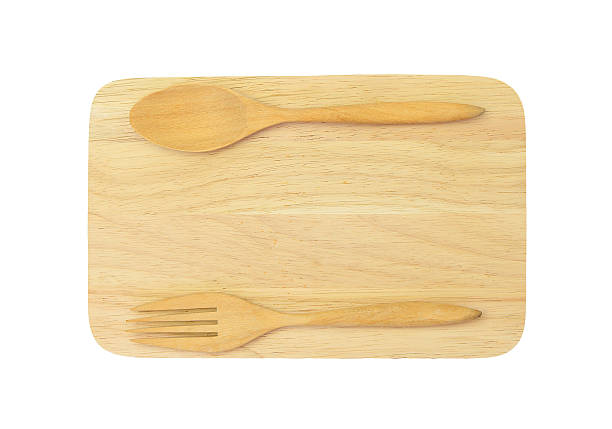 istock wooden spoon and fork on wooden board 475734334