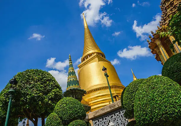 Classic golden buddhist chedi in Great Palace temple in Bangkok, Thailand