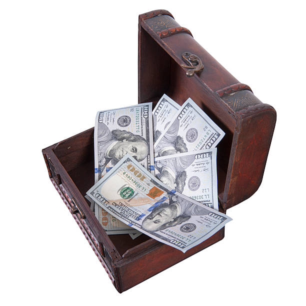 istock dollars in treasure box isolated on white 475735261