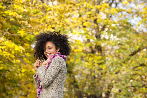 istock Cute mixed race woman smiling outdoors in nature 475735724