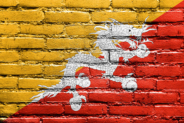 istock Bhutan Flag painted on brick wall 475737963