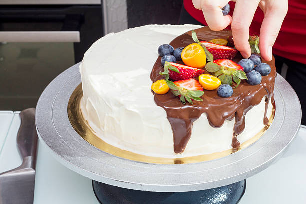 istock Chef decorates berry cake with blueberries 475743986