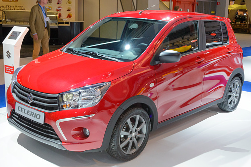 Amsterdam, The Netherlands - April 16, 2015:  on display during the 2015 Amsterdam motor show. People in the background are looking at the cars.Suzuki Celerio compact city car