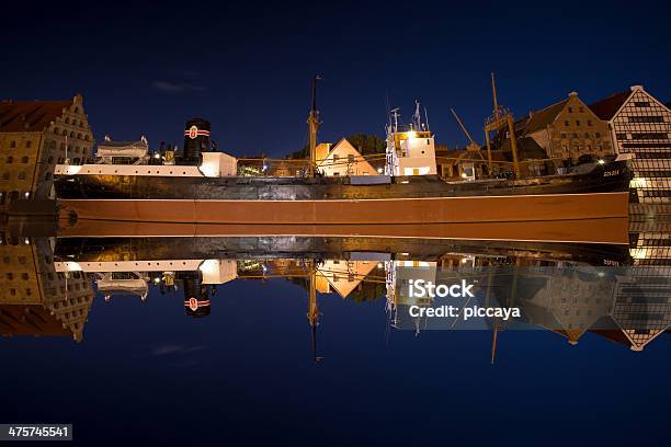 Reflections Of Ship At Night In River Motlawa Stock Photo - Download Image Now - Architecture, Boat Deck, Brown