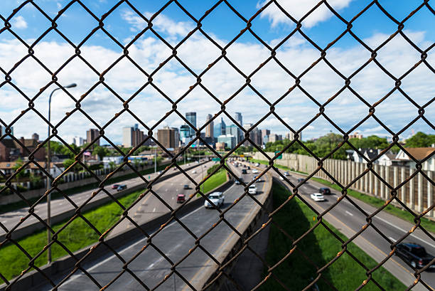 istock Minneapolis City Skyline and Freeway Seen Through Fence 475746152