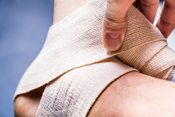 istock Leg tensor bandage being applied outdoors 475747046