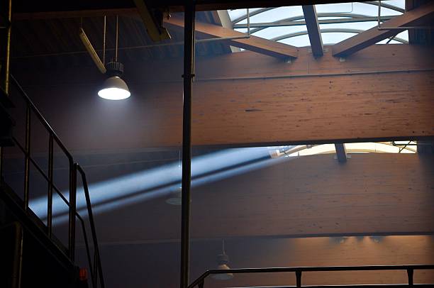 istock Sun ray in dark factory 475747102