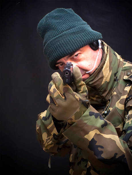 istock Soldier with gun and camouflage suit 475747748