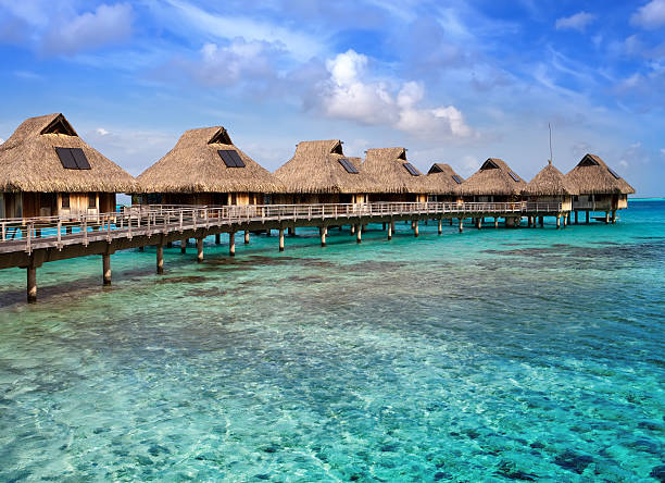 istock Typical Polynesian landscape -small houses on water. 475747906