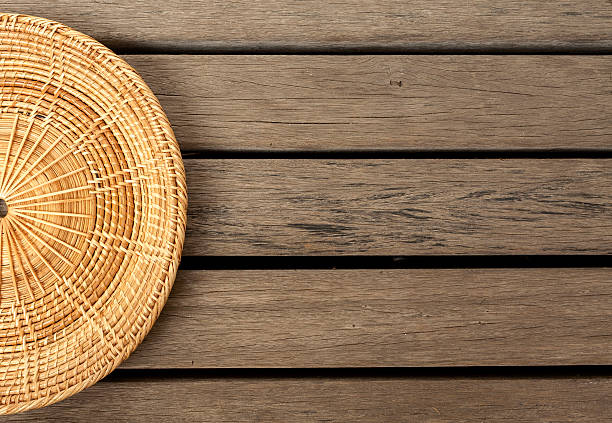 istock Rattan placemate on wood floor background 475748324