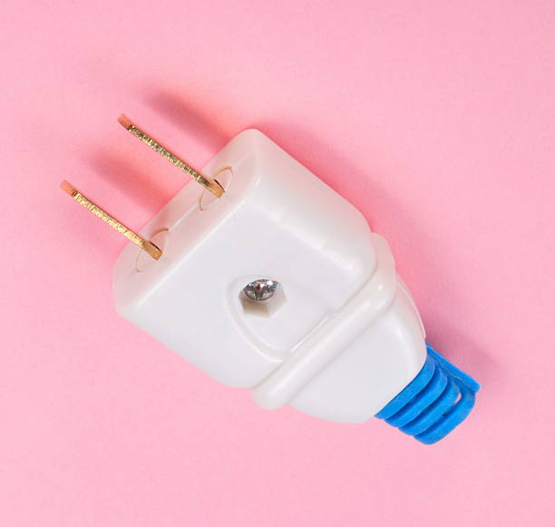 istock American Outlet Plug on pink background 475748506