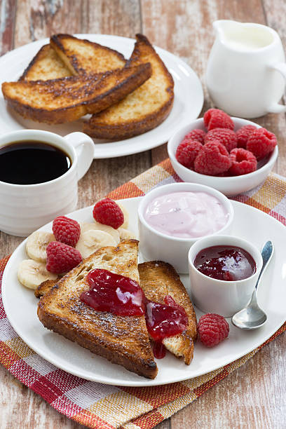 istock sweet toasts with raspberry, jam and yoghurt for breakfast 475749140
