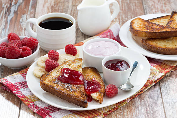 istock sweet toasts with raspberry, jam and yoghurt for breakfast 475749144