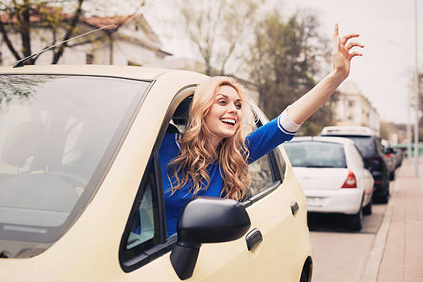 istock Smiling woman driving 475749406