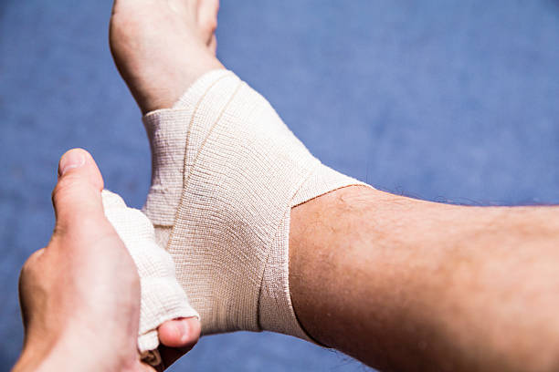istock Leg tensor bandage being applied outdoors 475750460