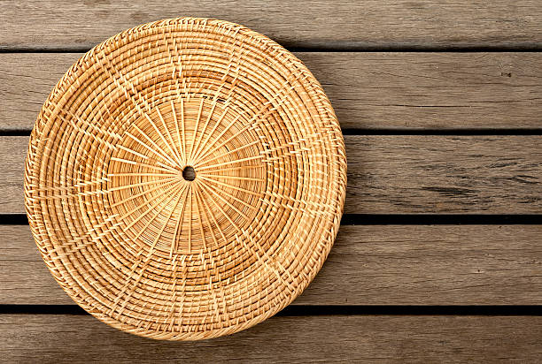 istock Rattan placemats with space on wood floor 475750484