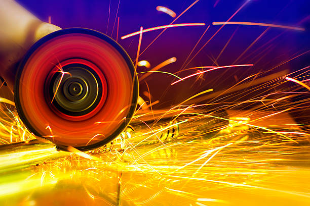 Sparks from circular saw. Metal sawing close up.