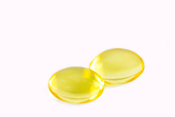 istock Rice bran oil pills on white background 475751876