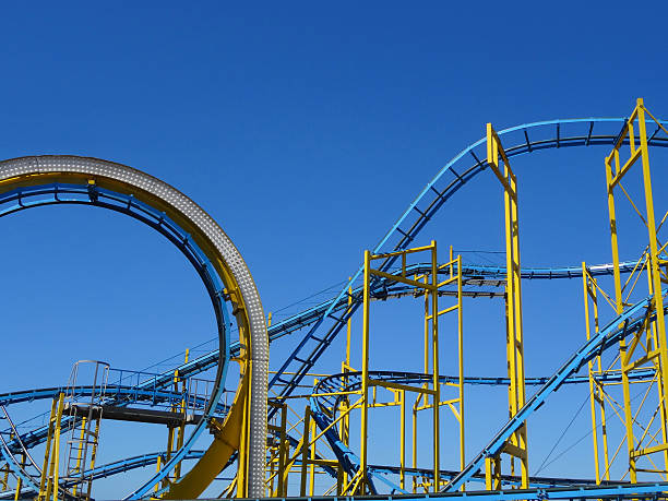 istock Image of rollercoaster loop and tracks / rails isolated against sky 475753660
