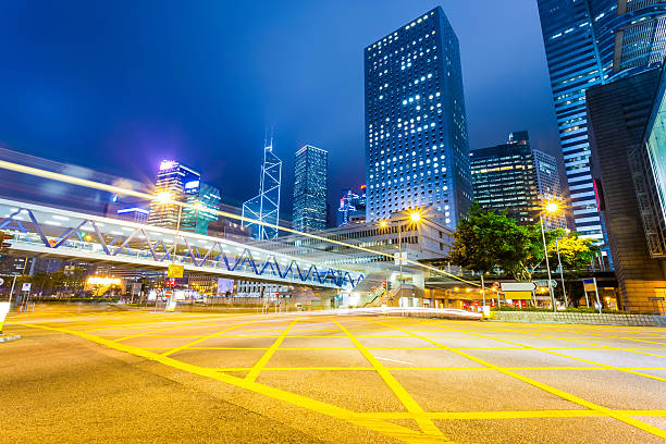 istock Traffic light trails in illuminated city 475755942