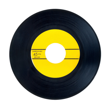 old 45 RPM vinyl record with yellow label on a white background