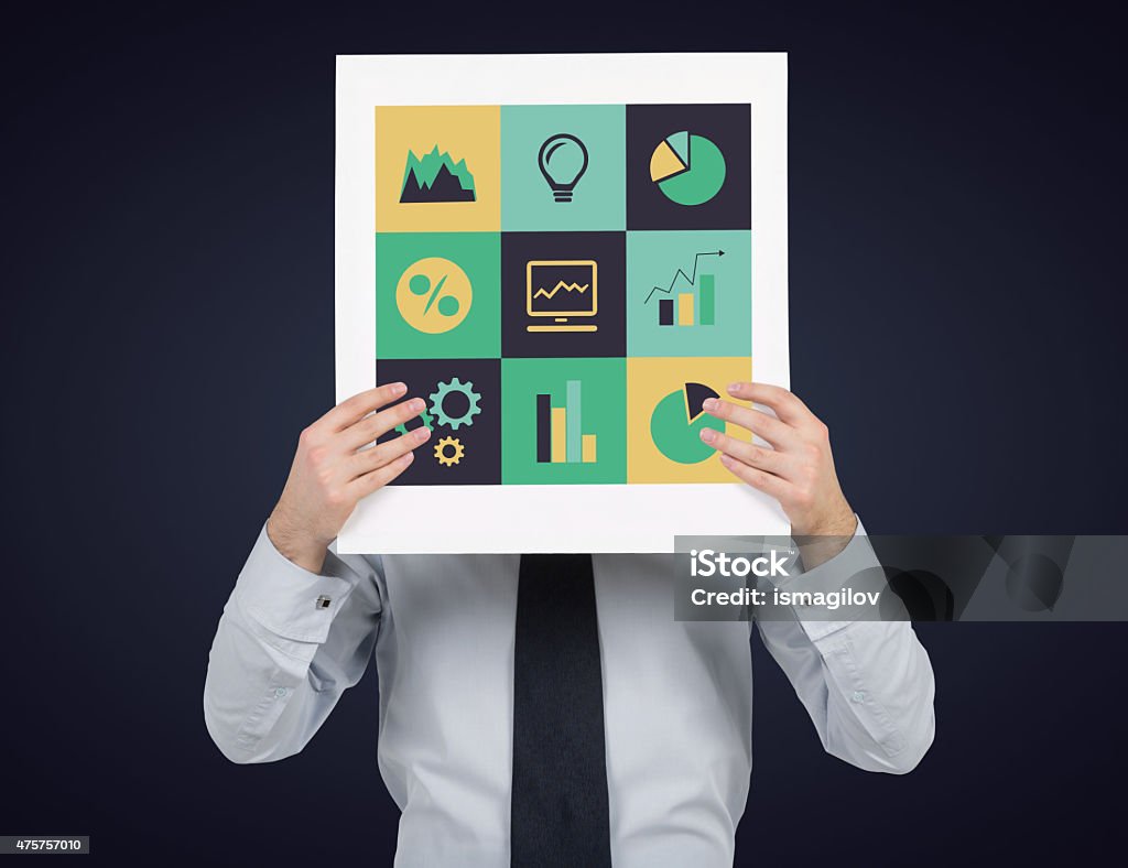 business icons businessman holding placard with business icons 2015 Stock Photo