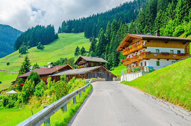 istock Typical alpine building oon green meadow, Austria 475757740