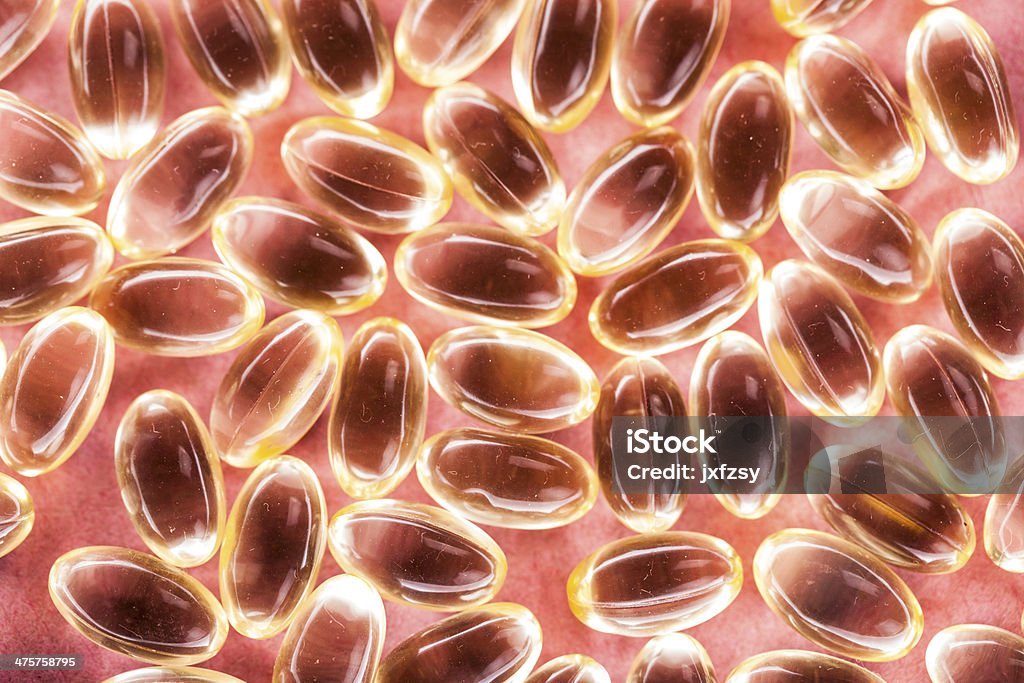 supplement oil capsules Close up shots of health supplement oil capsules with backlight on CoQ10 Stock Photo