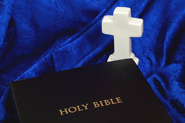 istock Holy Bible with White Cross 475759031