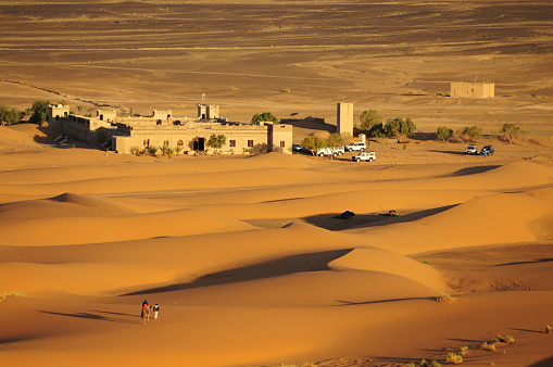 Camp site and parking in the Moroccan Sahara desert.
