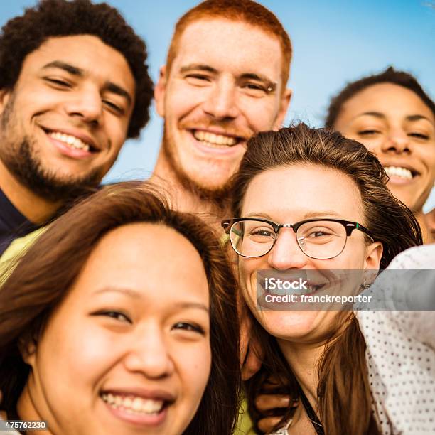 Group Of Friends Laughing And Doing A Selfie Stock Photo - Download Image Now - Multiracial Group, Teenager, Adolescence