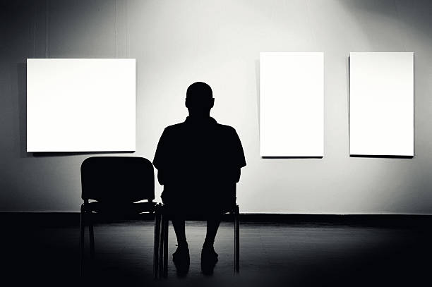 istock Man sitting in art gallery 475762751
