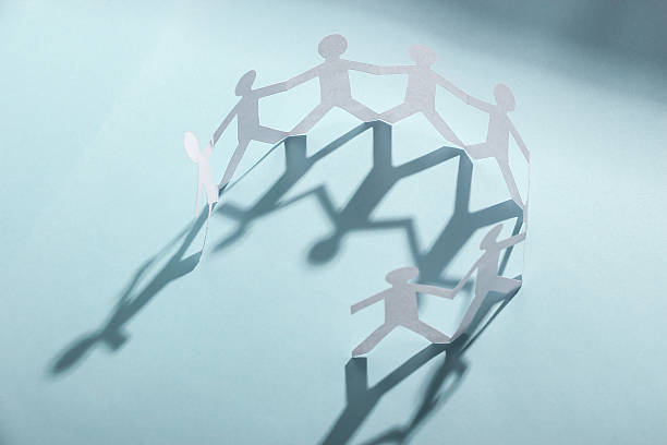 istock Group of people holding hands 475762844