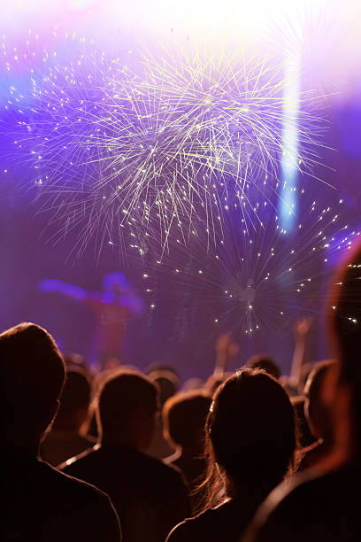 istock Cheering crowd in front of stage lights - retro photo 475763298