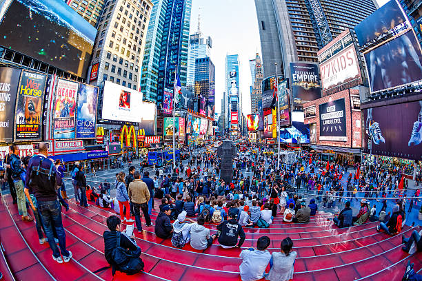 istock People on red steps at Times Square, New York City 475763518