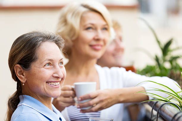 istock mature woman on a balcony 475766820