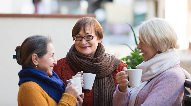 istock Senior women drinking tea at balcony 475767170