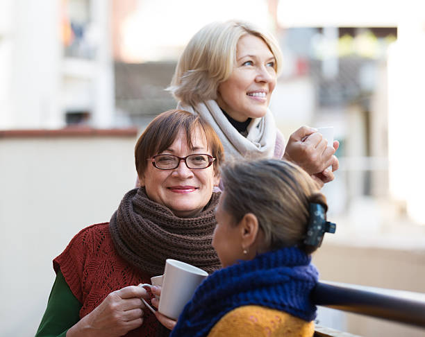 istock Senior women drinking tea at balcony 475767182