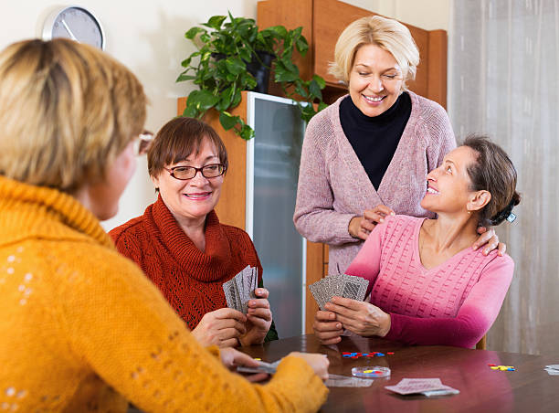 istock Pensioners having fun with cards 475767296