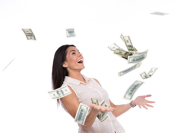 istock Businesswoman under money rain 475767632