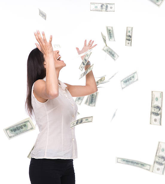 istock Businesswoman under money rain 475767670
